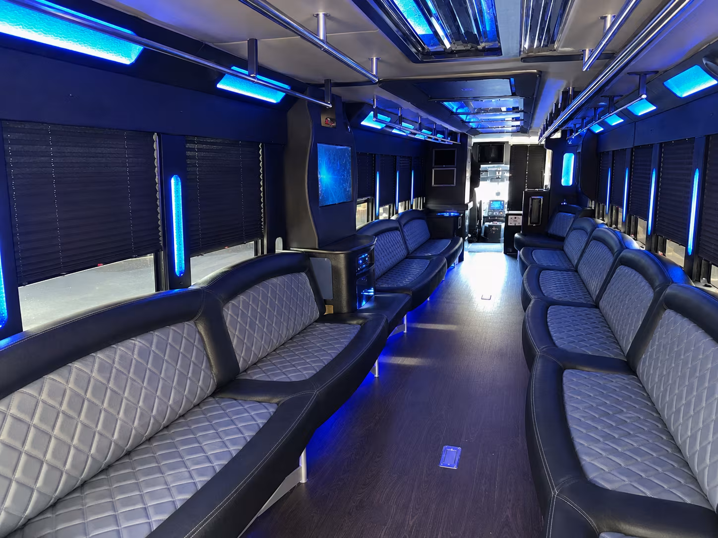 Friends laughing during a party bus celebration in Denver